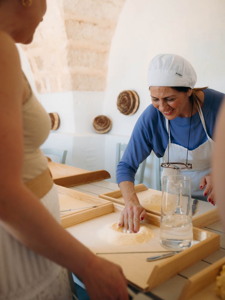 learning how to make fresh pasta in our retreat with our nonna chef